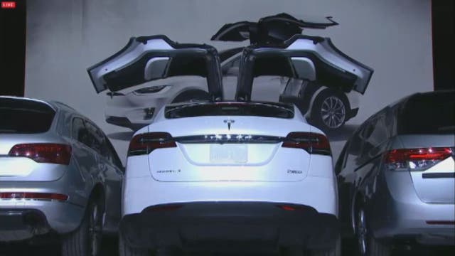 Elon Musk unveils Tesla's first SUV, the Model X