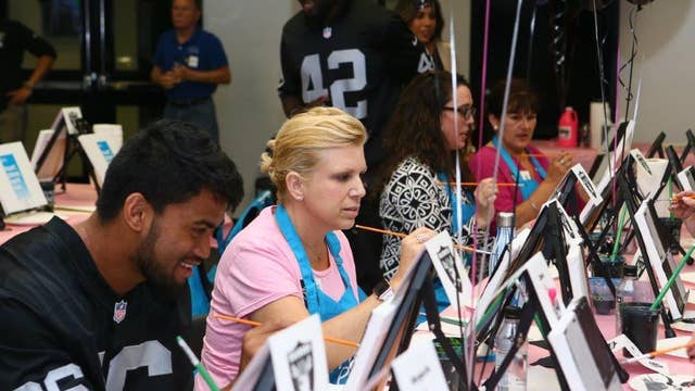 Raiders host breast cancer survivors for a creative experience