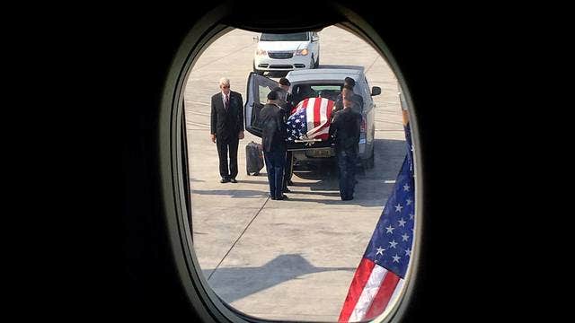 Flight goes silent for fallen soldier being returned home 64 years after his death