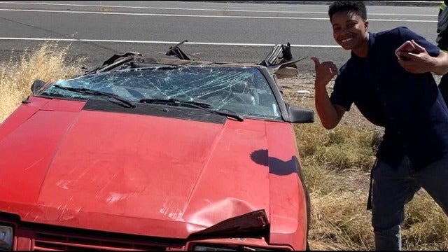 Driver unhurt after collision with semi truck shears off roof of his car