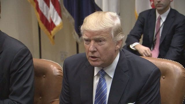 Trump seeks pause in legal fight with revised travel ban