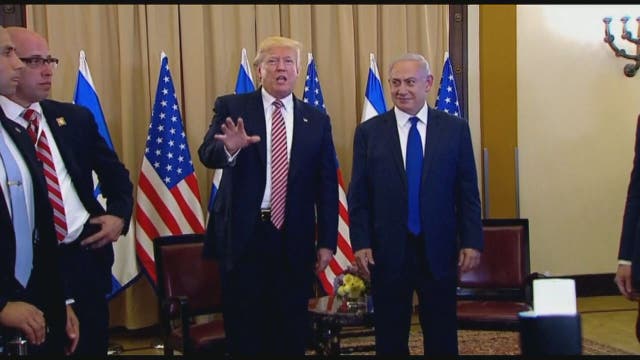 Questions about Russia chase Trump during first Israel visit