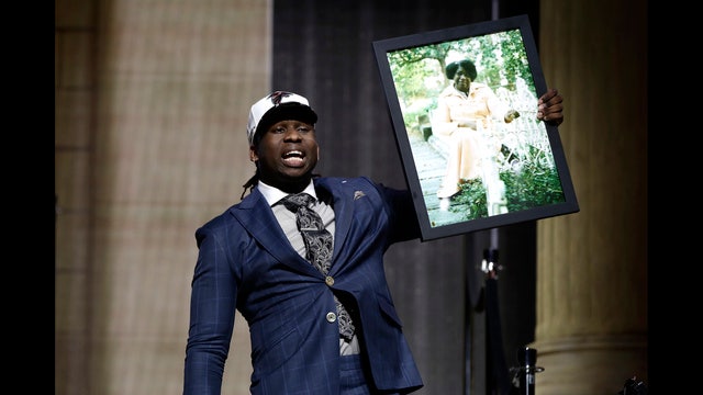 Richmond native drafted byFalcons, carries photo of grandma to stage