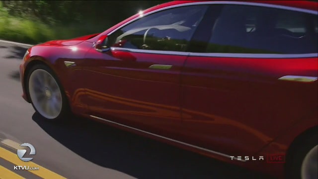 Tesla meets production goal, eyes new standard