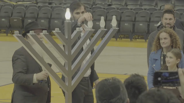 Warriors' Israeli player, Omri Casspi, delivers at game, lights menorah for Hanukkah