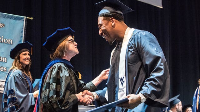 6 years after leaving college, Raiders Bruce Irvin returns to WVU to get his degree
