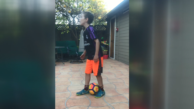 That Kid's Got Game: Nine-year-old Burlingame soccer player rainbow kicks ball into basketball hoop