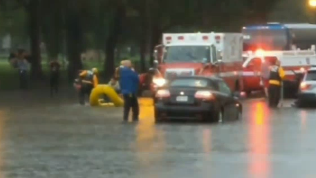 Rains strand Washington drivers, flood White House basement