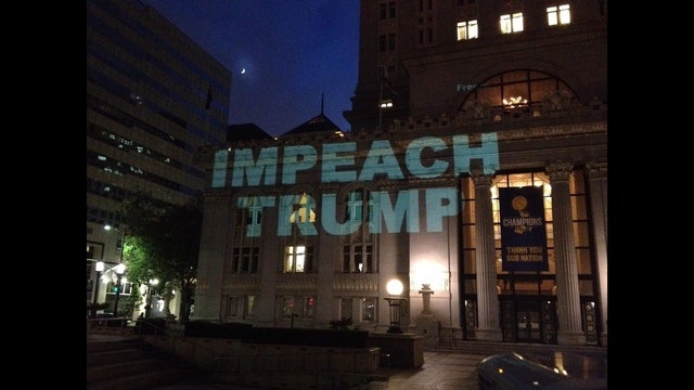 Oakland City Hall lights up with 'Impeach Trump' sign, council votes for Congress investigation
