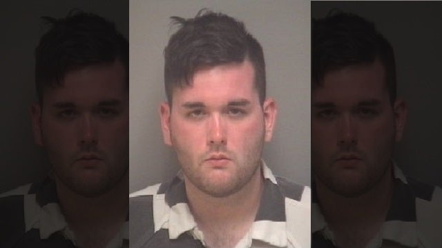 Man accused of ramming protesters pictured with racist group