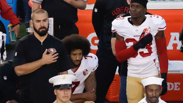 Kaepernick kneels during national anthem after socks stir controversy
