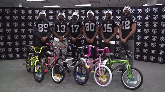 Raiders give bikes to kids