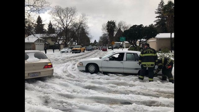 It's not snow, it's graupel!  Either way, Sacramento blanketed in white pellets