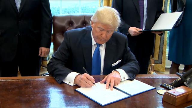 Trump moves to build border wall, cut sanctuary city funds