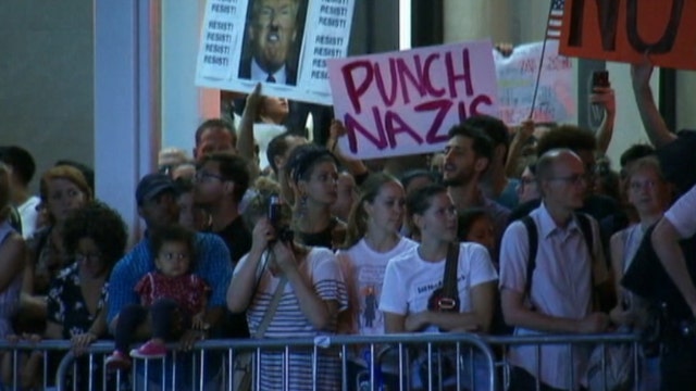 Thousands of protesters gather at Trump Tower