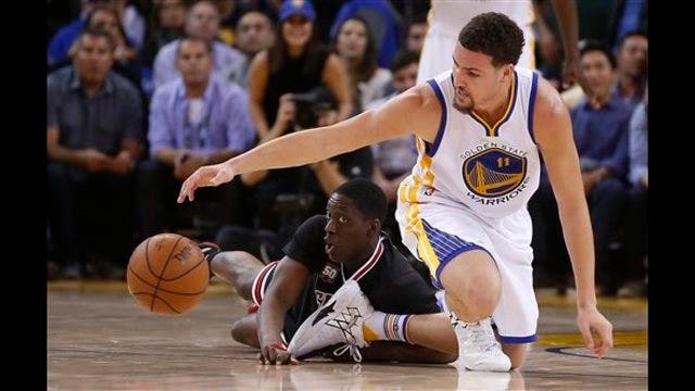 Curry leads Warriors to 14-0 start as they hold off Bulls