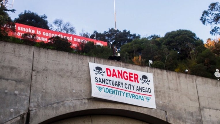 11P TSE SANCTUARY CITY SIGNS_00.00.00.00_1517232874264.png.jpg
