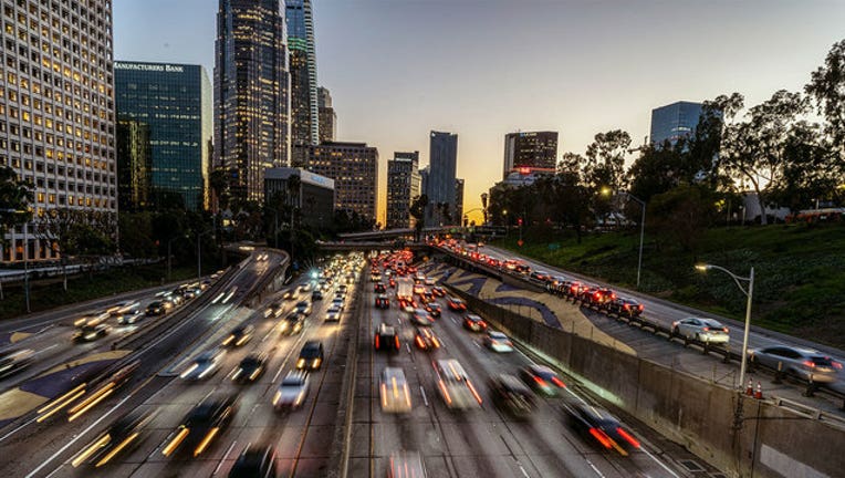 a0a57e79-GETTY-Los-Angeles-Traffic-drivers-driving-downtown-la-L.A.-los-angeles-skyline-100-freeway_1561994742676-407068.jpg