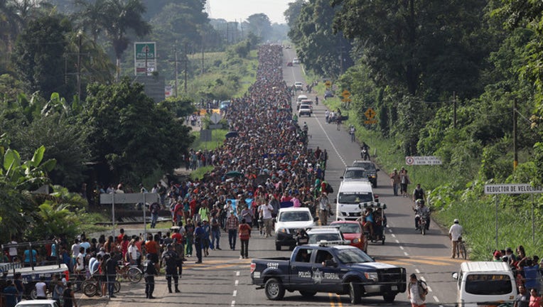 b2eefa51-775243532JM224_Migrant_Cara_1540828345507-408200