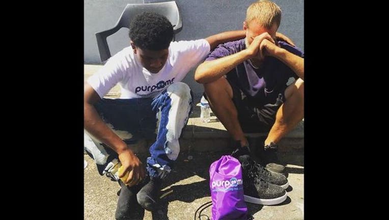 254a80de-Teen gives homeless shoes
