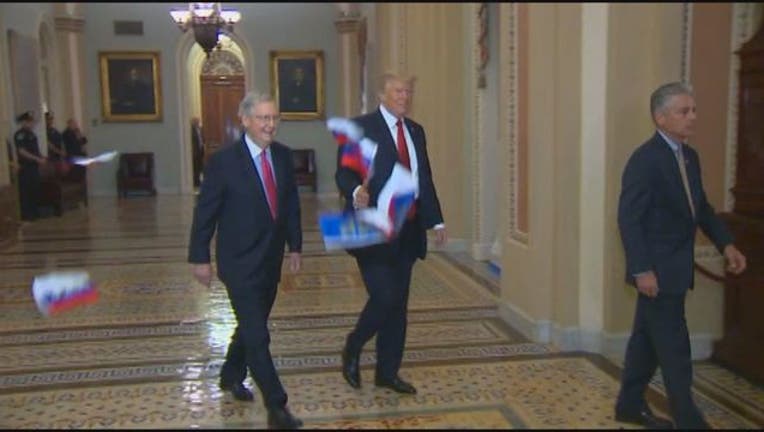 bf0e6fdb-Trump Russian Flags Tossed Capitol-401720.jpg