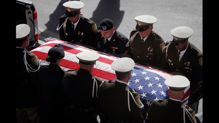 ed4f3d6f-Las Vegas Shooting Officer Funeral_1509686968037