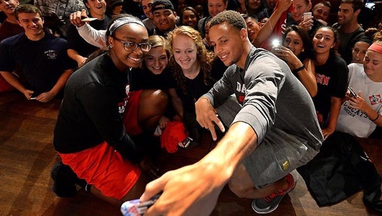 c2e13524-APTOPIX Curry-Championship Trophy Basketball_1442519027653