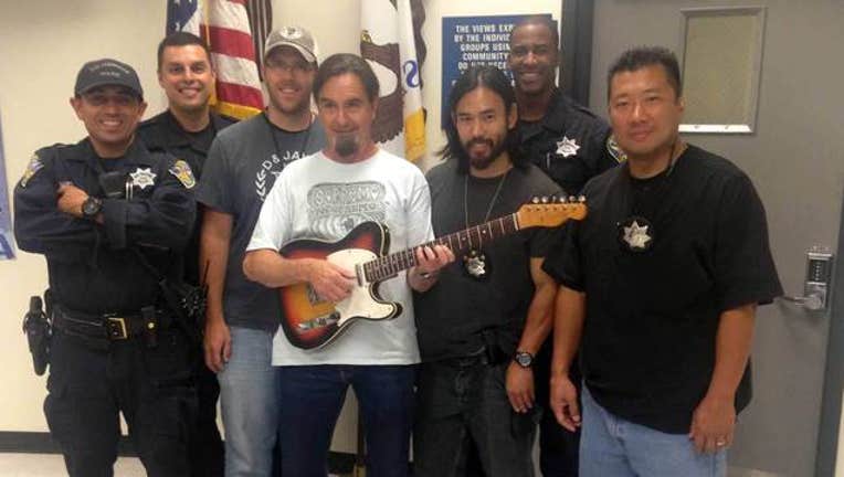 d868b46a-stolen RHCP guitar