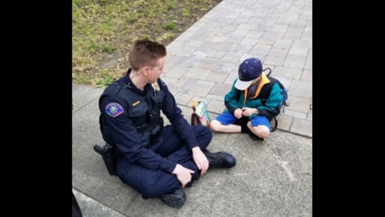 88efba6c-rohnert park police sitting with boy_1558463858731.PNG.jpg