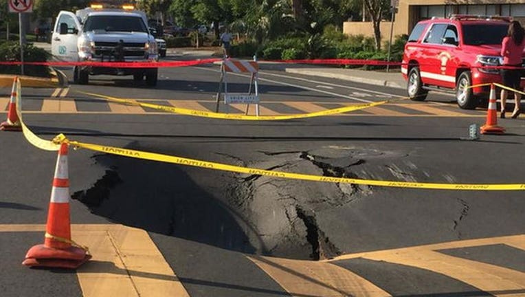 b6389dfe-Permanent repairs begin for Union City sinkhole that began in October.