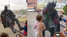 SWAT team member dressed as Batman surprises patients at children’s hospital, rappelling down side of building