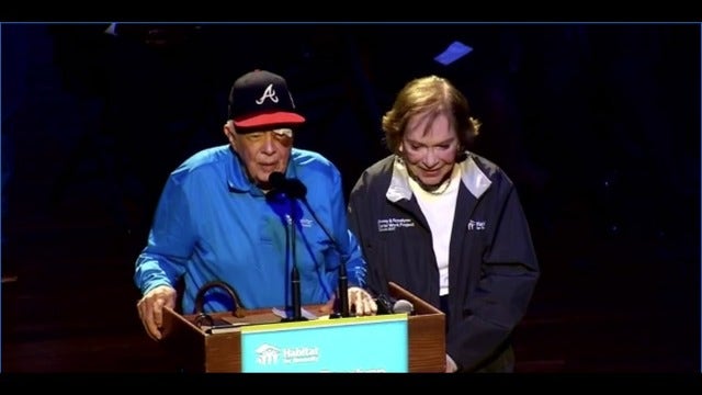 Despite fall, 95-year-old former President Carter helps build home