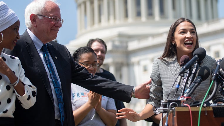 Representative Alexandria Ocasio-Cortez (2nd R), Democrat of New York, speaks alongside US Senator Bernie Sanders (2nd L), Independent of Vermont, and Representative Ilhan Omar (L), Democrat of Minnesota, during a press conference to introduce college affordability legislation outside the US Capitol in Washington, DC, June 24, 2019. (Photo by SAUL LOEB / AFP) (Photo credit should read SAUL LOEB/AFP/Getty Images)