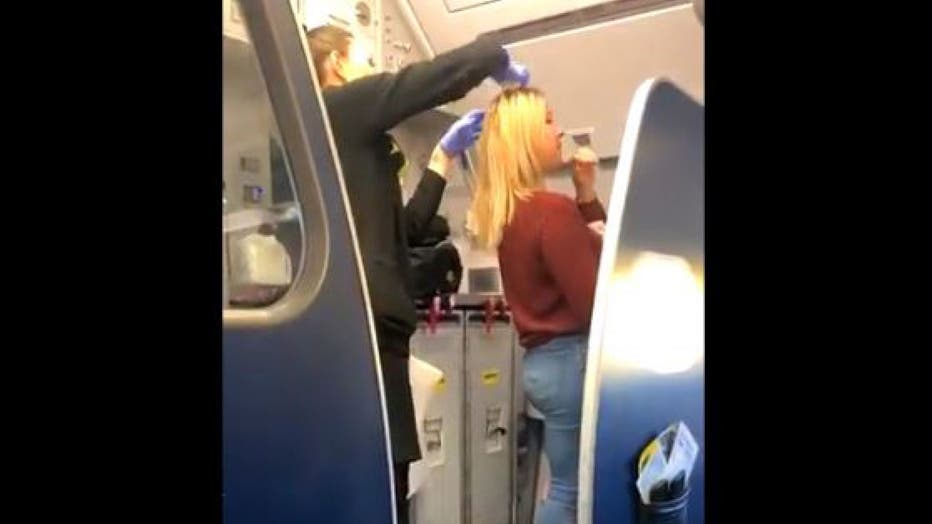 The female passenger was tended to by flight attendants. According to nearby passenger Cassidy Smith, the woman was forced to wash her hair in the bathroom sink.