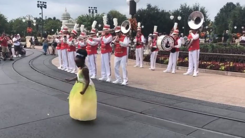 Sydney Russell, 8, busted a move with a band at Walt Disney World when she visited the park to celebrate her birthday. (Photo credit: Tiffany McKinnon Russell)