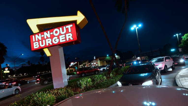 Drivers wait in the drive-thru line at an In-N-Out Burger restaurant in Alhambra, California, on August 30, 2018. - California's Democratic Party Chairman, Eric Bauman, is calling for a boycott of the Irvine, CA based fast food chain after it donated $25,000 to help California Republicans in November. In addition to this week's donation, In-N-Out donated $30,000 to the GOP in 2017 and 2016. (Photo by Frederic J. BROWN / AFP) (Photo credit should read FREDERIC J. BROWN/AFP via Getty Images)