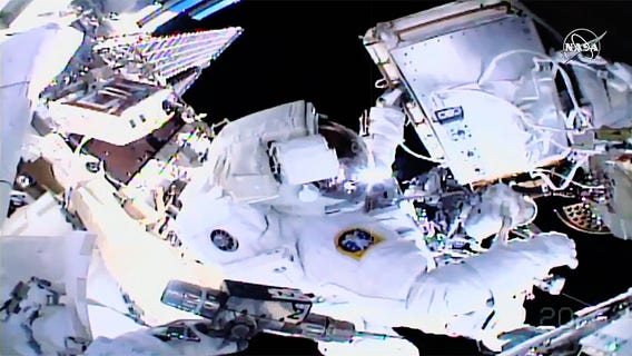 Spacewalking astronauts plug leak, finish fixing detector