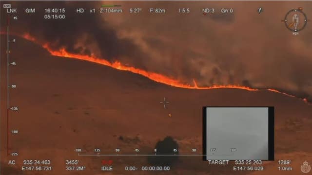 Some flee, others restock before Australia's wildfires grow