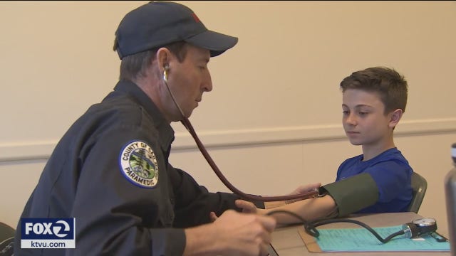 Health professionals volunteer to conduct heart screenings on teens and young adults