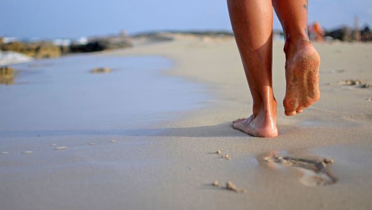 woman walking on the beach