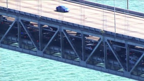 Suspect wanted after Bay Bridge crash, carjacking