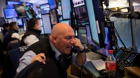 Dow reclaims 20K protecting Trump-era gains