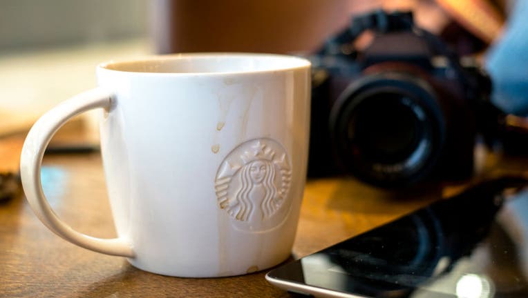 Coffee cup on table, while the customer has a break in a