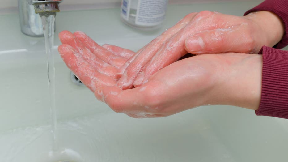 A girl washes her hands with soap and water. Hand hygiene measures are among the most important infection prevention measures. Personal hygiene, especially thorough hand washing, is particularly important as protection against the coronavirus.