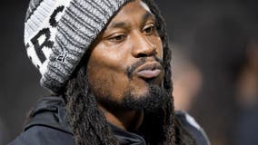 Oakland's Marshawn Lynch hands out free face masks