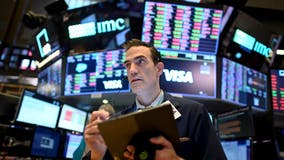 Stocks rise on Wall Street, but US braces for 100,000 deaths