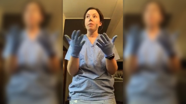 nurse shows how even when you wear gloves coronavirus cross contamination