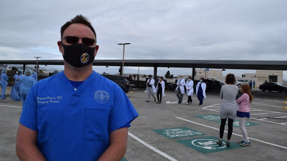 Medical personnel appreciate military jet flyover salute