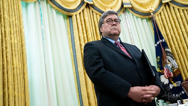 Attorney General William Barr listens as U.S. President Donald Trump speaks in the Oval Office before signing an executive order related to regulating social media on May 28, 2020 in Washington, DC. 