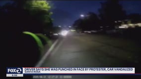 Woman assaulted after driving into protest, some claim driver acted intentionally